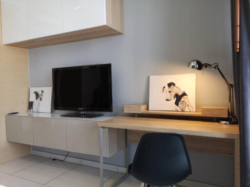 Modern living area with TV and workspace