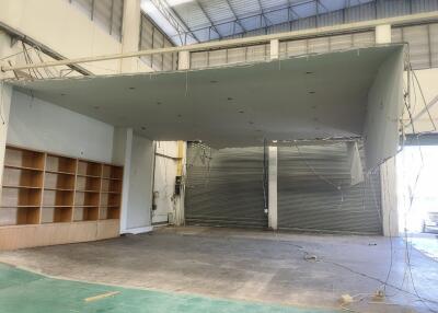 large warehouse interior with partial ceiling work