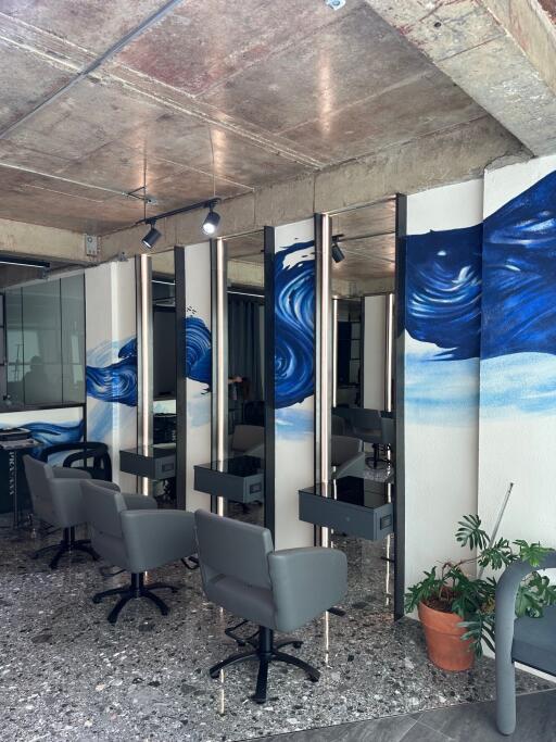 Modern hair salon interior with styling chairs and mirrors