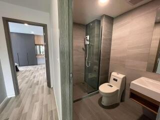 Modern bathroom with shower, toilet, and sink