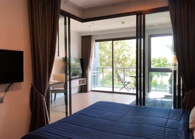 Spacious bedroom with balcony and natural light