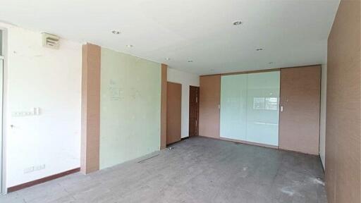 Empty bedroom with built-in wardrobe