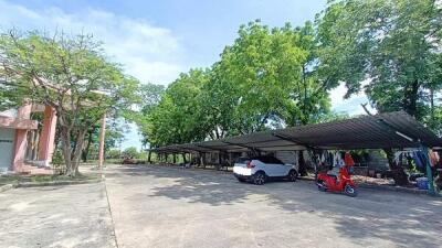 Parking area with carports and vehicles