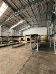 Spacious warehouse with metal shelves