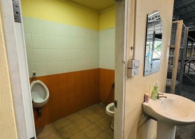 Bathroom with urinal and toilet