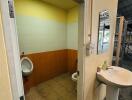 Bathroom with urinal and toilet