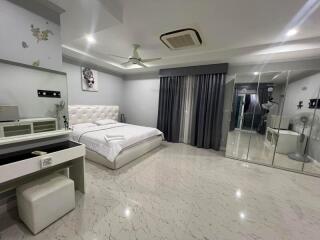 Spacious bedroom with modern decor and amenities