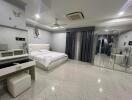 Spacious bedroom with modern decor and amenities