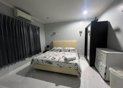 Modern bedroom with double bed and ample storage