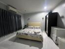 Modern bedroom with double bed and ample storage