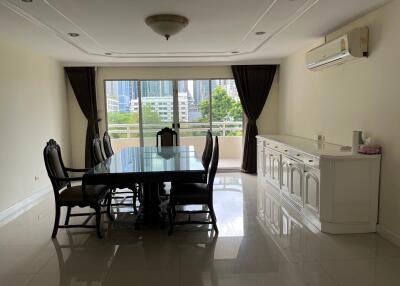 Spacious dining room with large window and city view