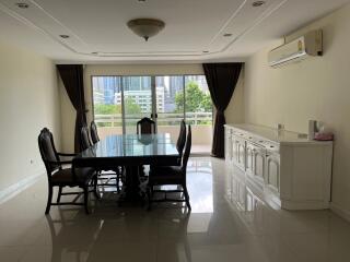 Spacious dining room with large window and city view