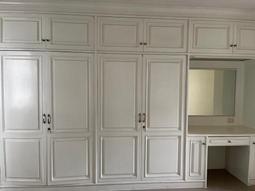 Built-in wardrobe with dresser and mirror