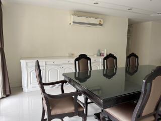 Dining room with glass-top table and chairs