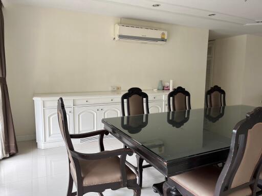 Dining room with glass-top table and chairs