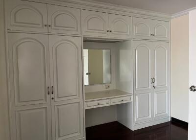 Bedroom with built-in wardrobe and vanity desk