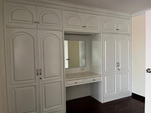 Bedroom with built-in wardrobe and vanity desk