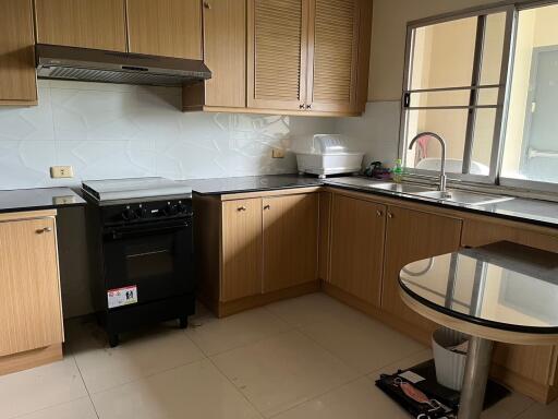 Modern kitchen with wooden cabinets and appliances