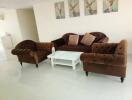 Living room with brown sofas and white coffee table