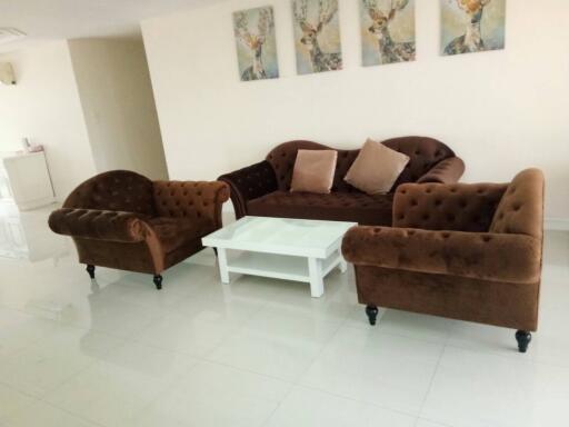 Living room with brown sofas and white coffee table