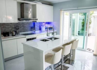 Modern kitchen with island and bar stools