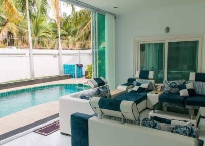 Modern living room with pool view