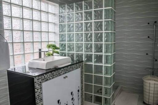 Modern bathroom with glass block shower