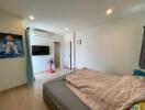 Master bedroom with air conditioning and wall-mounted television