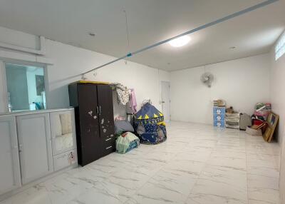 Spacious multi-purpose room with storage and kids