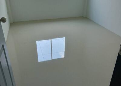 Empty white bedroom with a window