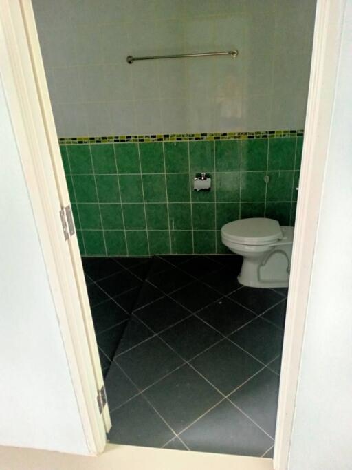 Bathroom with green tiles