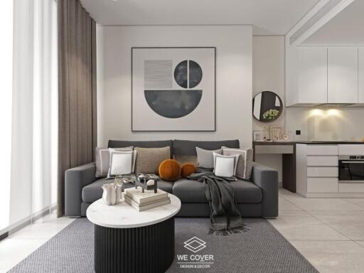 Modern living room with a grey sofa, abstract wall art, and a kitchen