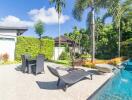 Spacious backyard with pool, greenery, and seating area