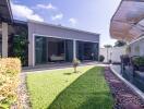 Modern house with garden and water feature