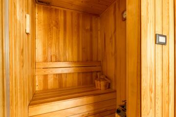 Wooden sauna interior with bench seating