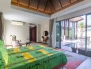 Spacious bedroom with a view of the pool and patio