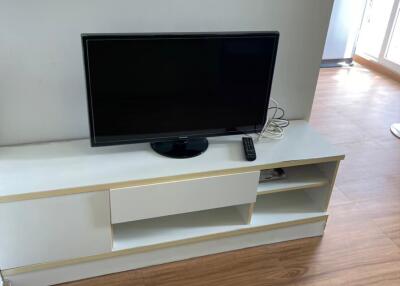 Modern living room with TV stand and hardwood floors