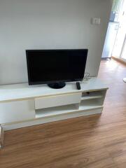 Modern living room with TV stand and hardwood floors