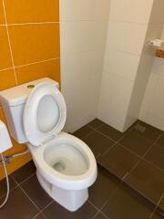 Modern bathroom with toilet and tiled flooring