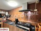 Modern kitchen with stove and extractor hood