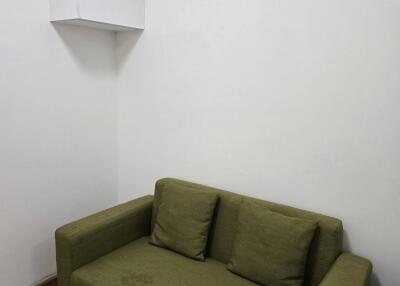 small living room with green couch