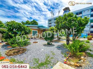 Front yard with a small house