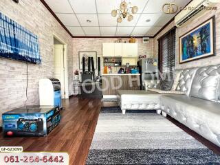 Spacious living room with hardwood floors and modern decor