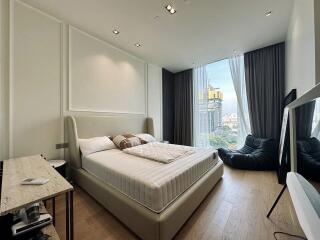 Modern bedroom with large window and city view