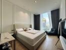 Modern bedroom with large window and city view