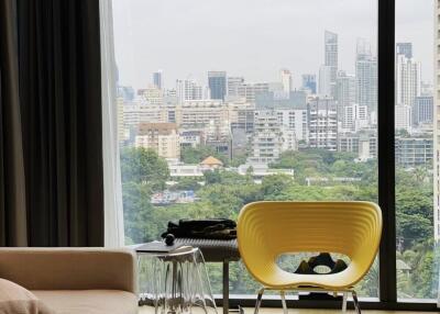 Living area with large window offering city views