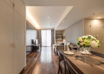 Modern living and dining space with wooden flooring and contemporary decor