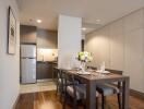 Modern kitchen and dining area with wooden dining table and chairs