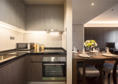 Modern kitchen and dining area with appliances and dining table