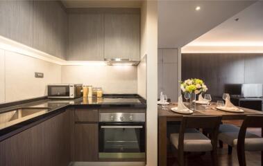 Modern kitchen and dining area with appliances and dining table